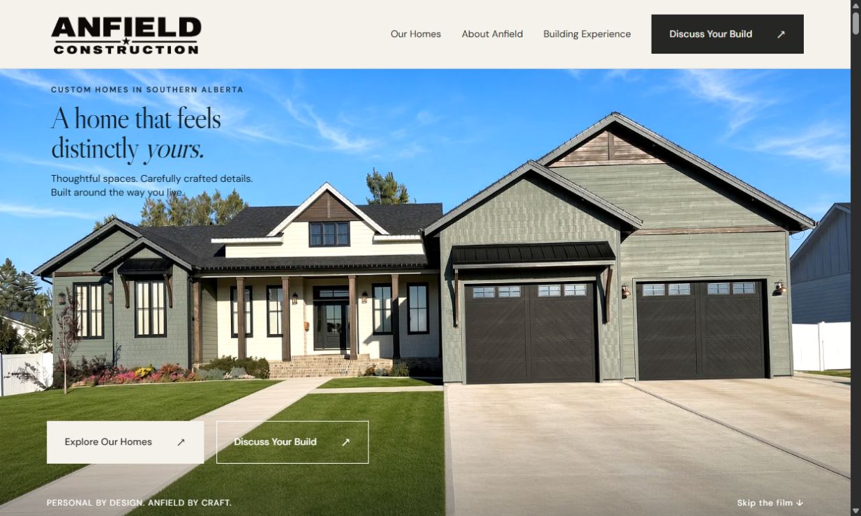 Anfield Construction homepage: A home that feels distinctly yours, with a completed custom home in daylight.